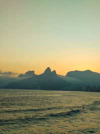 Scenic view of sea against clear sky during sunset