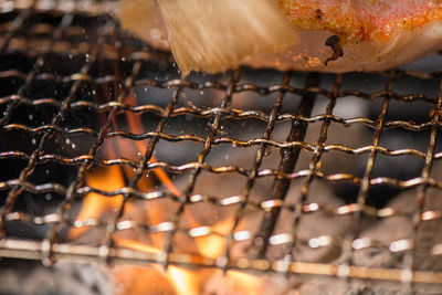 Close-up of meat on barbecue grill