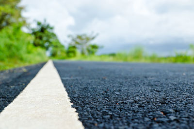 Surface level of road against the sky