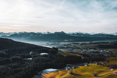 Scenic view of landscape and mountains against sky