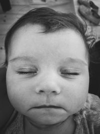 Close-up portrait of cute girl with eyes closed