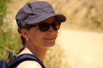 Portrait of smiling young woman wearing sunglasses