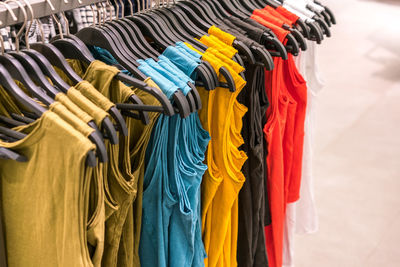 Close-up of multi colored clothing hanging in row