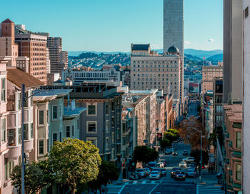 Street amidst buildings in city against sky