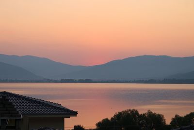 Scenic view of silhouette mountains against sky during sunset