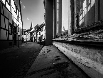 Empty alley amidst buildings in city