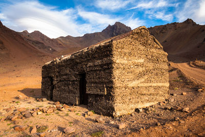 Built structure on land against sky