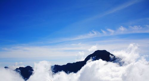 Low angle view of clouds against blue sky