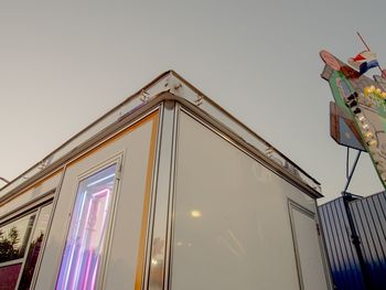 Low angle view of illuminated building against sky