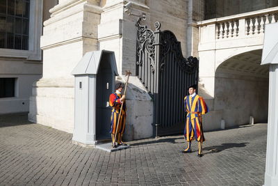 Man and woman walking in building