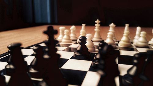 Close-up of chess pieces on table