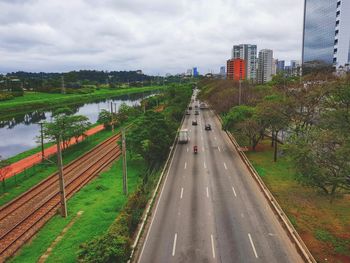 High angle view of road by city against sky