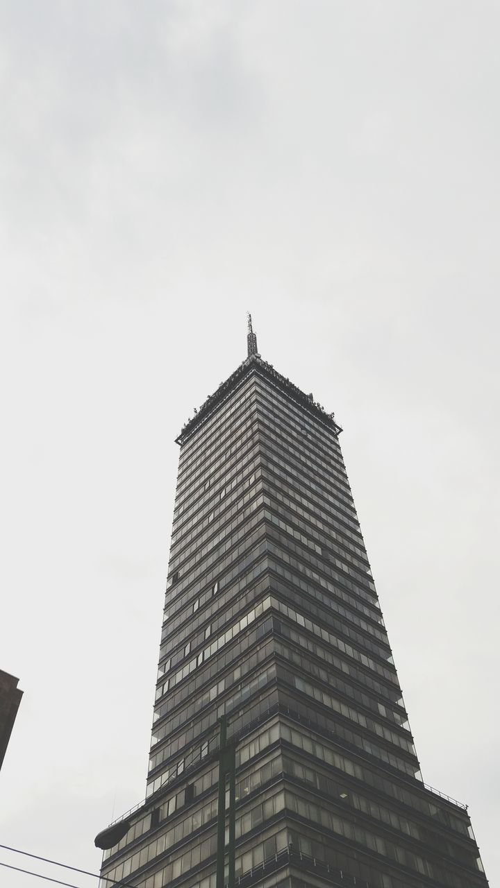 architecture, low angle view, built structure, building exterior, sky, tall - high, tower, city, high section, skyscraper, famous place, clear sky, travel destinations, outdoors, day, copy space, no people, building, modern, tall