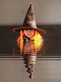 Portrait of woman with hat in water