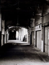 Empty street amidst buildings in city