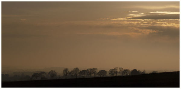 Scenic view of silhouette landscape against sky during sunset