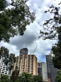 Low angle view of building against cloudy sky