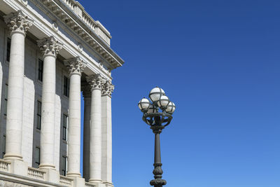 Low angle view of building against clear blue sky