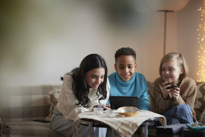 Children playing video games at home