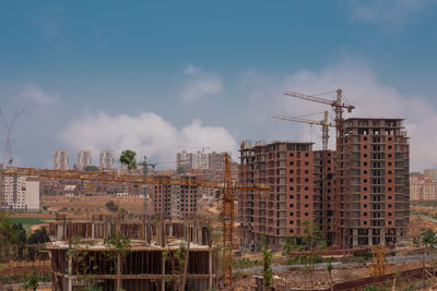 Buildings in city against sky