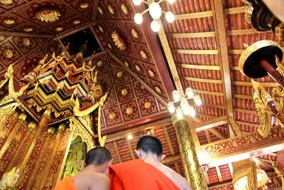 Low angle view of illuminated ceiling