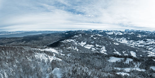 Scenic view of mountains against sky during winter