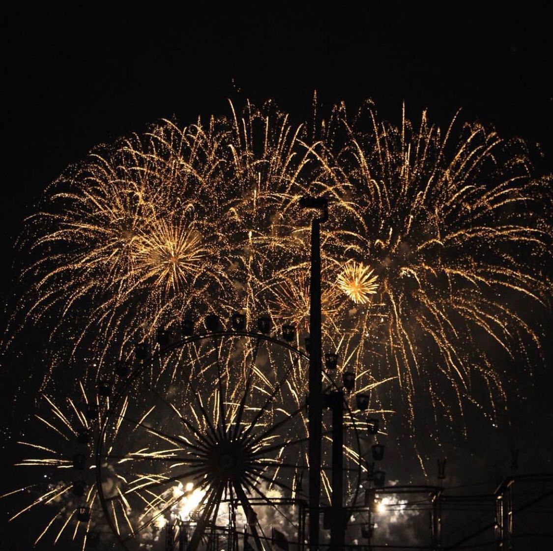 night, firework, illuminated, celebration, arts culture and entertainment, event, firework display, motion, exploding, long exposure, glowing, no people, firework - man made object, sky, low angle view, light, blurred motion, nature, architecture, outdoors, sparks, new year's eve, entertainment event