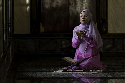 Woman standing on staircase