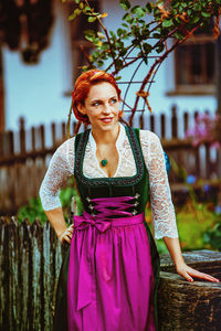 Woman wearing dirndl looking away