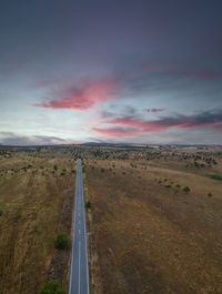 Aerial view of a country road at the sunset.