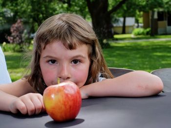 Portrait of a girl eating apple