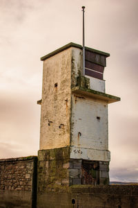 Low angle view of old building against sky