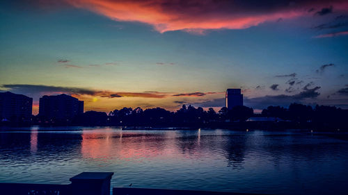 City at waterfront during sunset