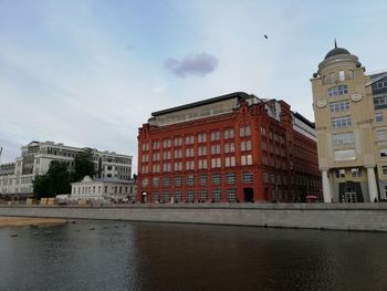 View of buildings against cloudy sky