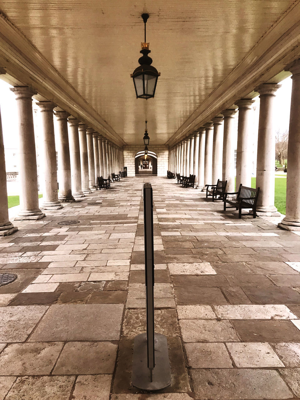 architecture, architectural column, built structure, colonnade, column, the past, lighting equipment, history, no people, in a row, travel destinations, the way forward, arcade, day, diminishing perspective, building, building exterior, travel, corridor, city, ancient history, arch, outdoors, street, tourism, footpath, nature