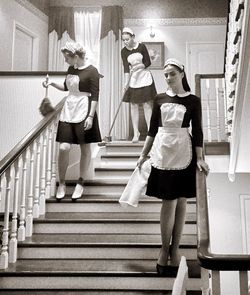 Low angle view of women standing on staircase