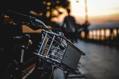 Close-up of bicycle at sunset