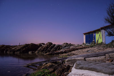 Scenic view of landscape against clear sky at night