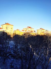 Buildings against blue sky and clouds