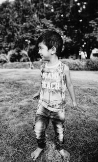 Boy looking away standing at park