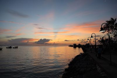 Scenic view of sea against sky at sunset