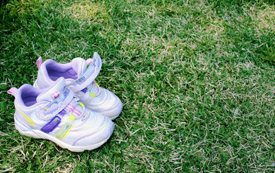 High angle view of shoes on field