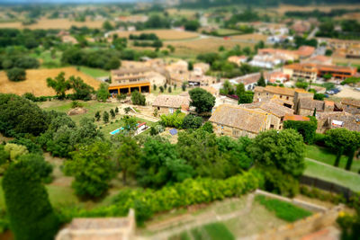 High angle view of townscape against trees and buildings