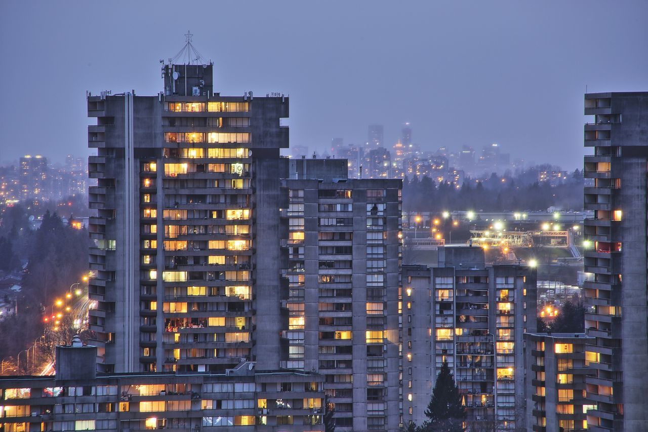 building exterior, architecture, built structure, city, skyscraper, cityscape, illuminated, office building, tower, tall - high, modern, clear sky, night, development, building, urban skyline, residential building, city life, financial district, tall