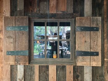 Reflection of glass of window on wooden table