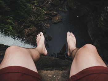 Low section of woman relaxing on beach