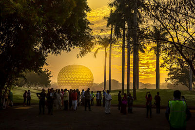 Group of people at sunset