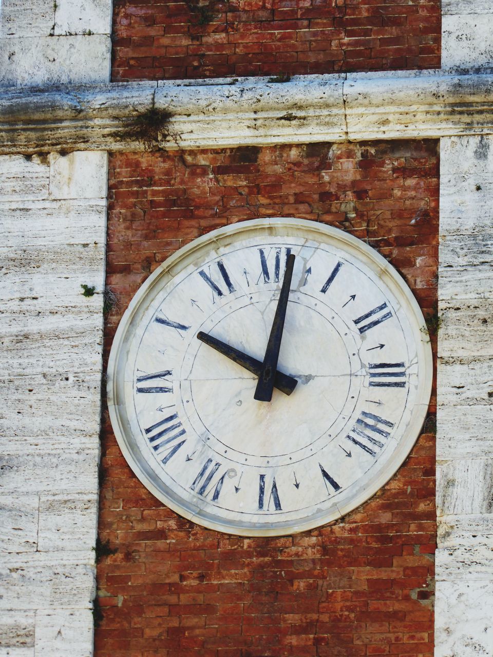 CLOSE-UP OF CLOCK ON WALL