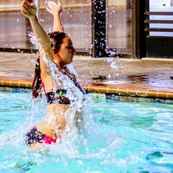 Woman enjoying in swimming pool