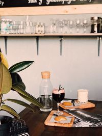 Close-up of wine bottles on table